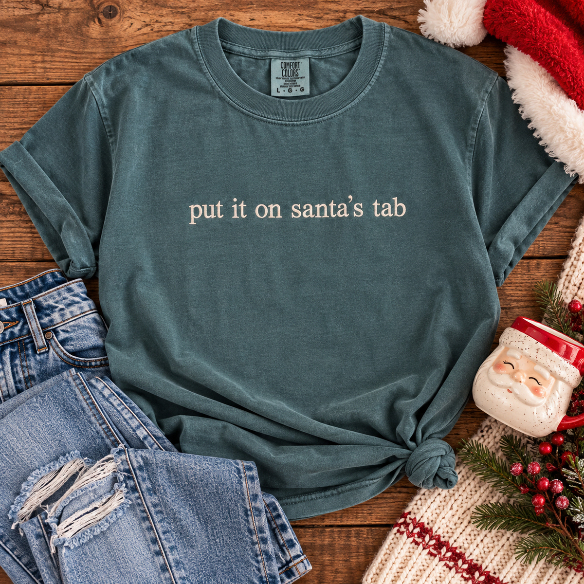 Put It on Santa’s Tab Embroidered Sweatshirt & Tee